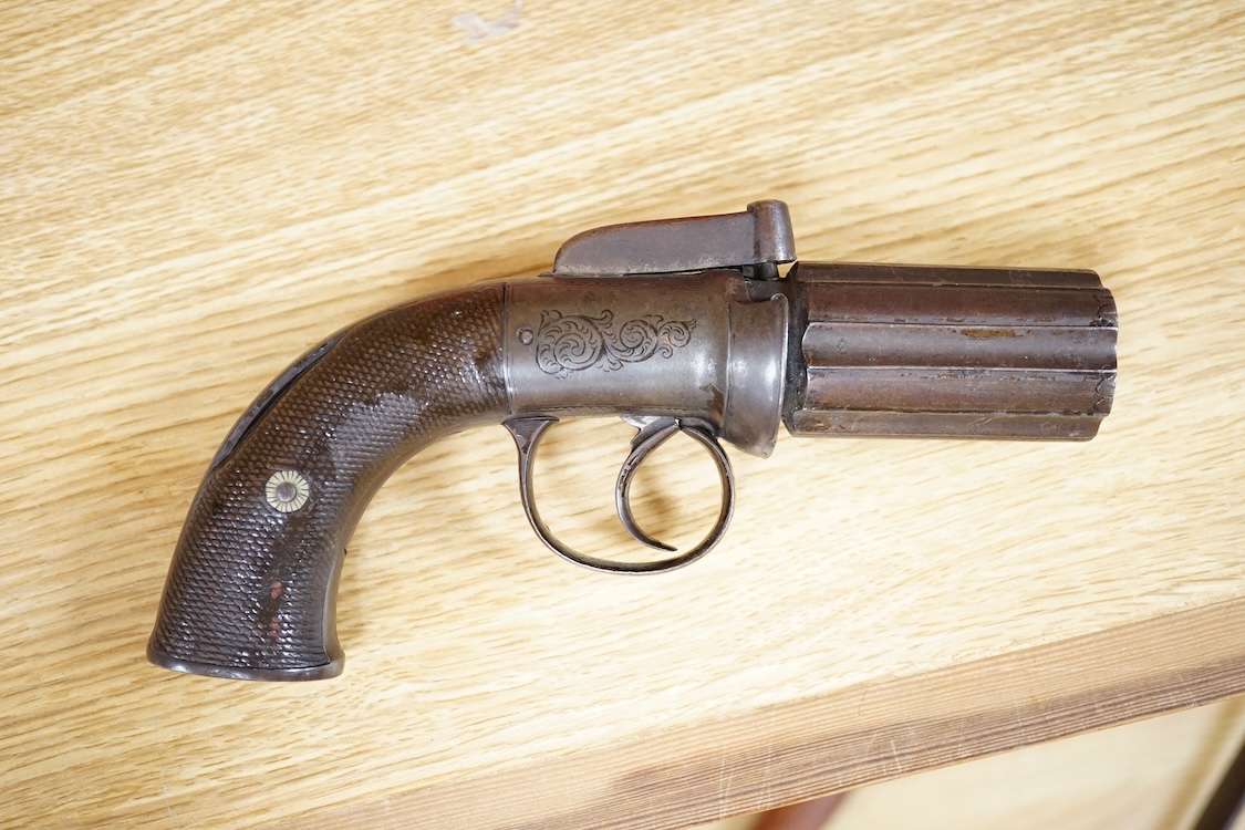 A six shot 120 bore self-cocking percussion pepperbox revolver with fluted barrels, Birmingham proof, rounded foliate engraved frame, and two-piece chequered walnut grips
